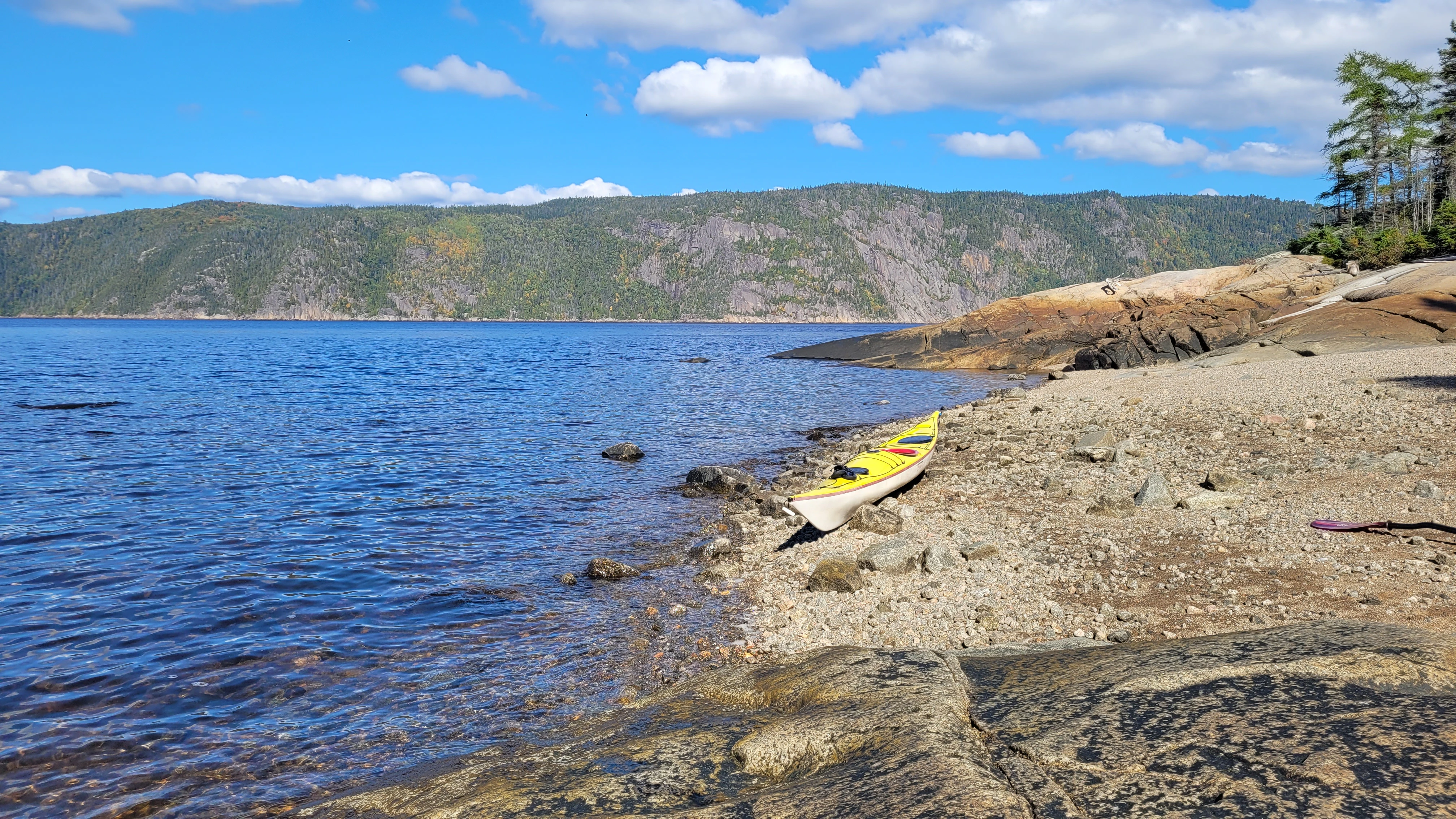 Taking a break during a sea kayak trip on the Saguenay River